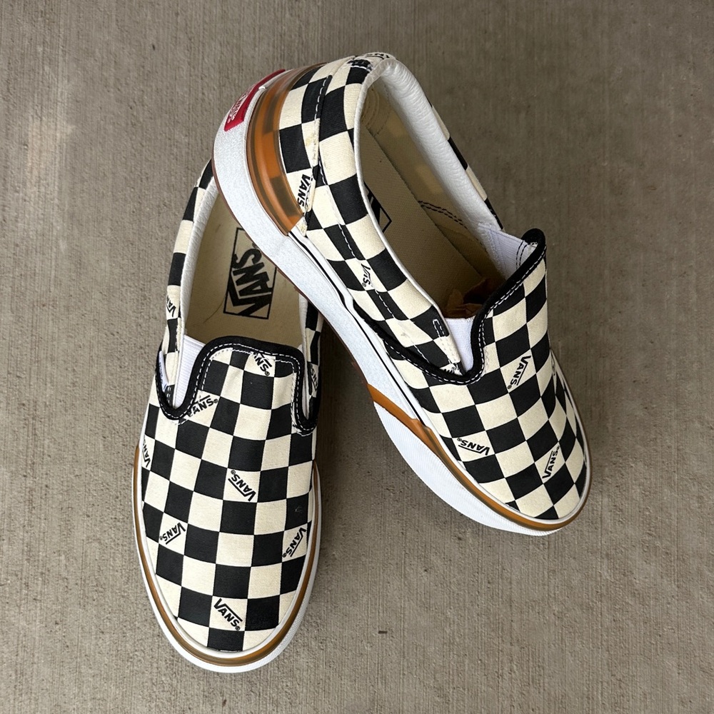 Vans Women’s Platform Black and White Checkered Slip-On Sneakers